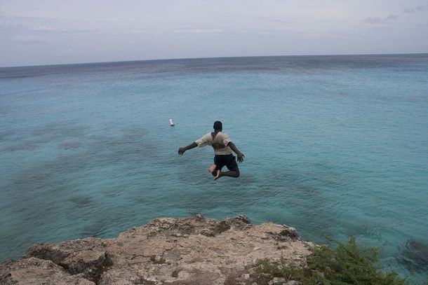 Leaping out to sea at Playa Abou, Curacao Leaping out to sea at Playa Abou, Curacao