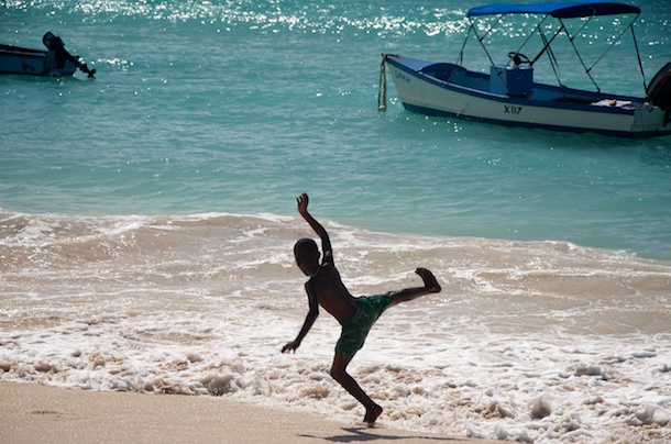 Playing in the Surf, Oistins Fish Market By Day, Barbados by Kathleen Bennett Playing in the Surf, Oistins Fish Market By Day, Barbados by Kathleen Bennett
