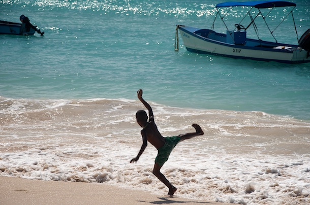 Playing in the Surf, Oistins Fish Market By Day, Barbados by Kathleen Bennett