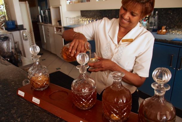 Diana Diana pours me a little orange spice infused rum