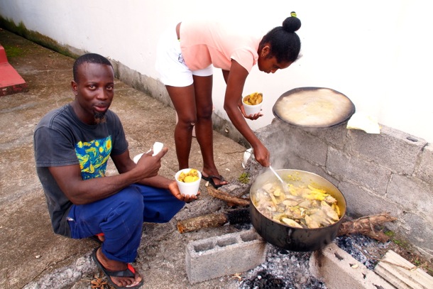 Tom and Charmane dishing up some Oil Down/SBPR