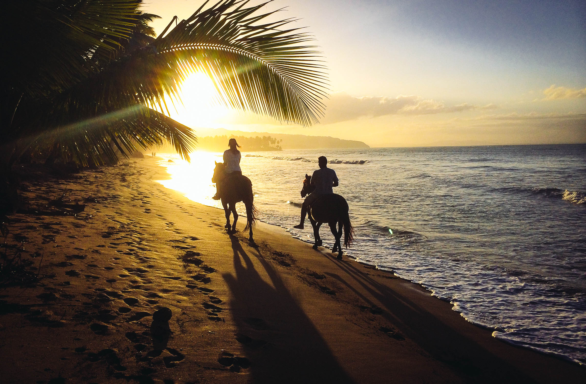 Horseback riding at sunset on the beach near Las Terrenas by Patrick Bennett