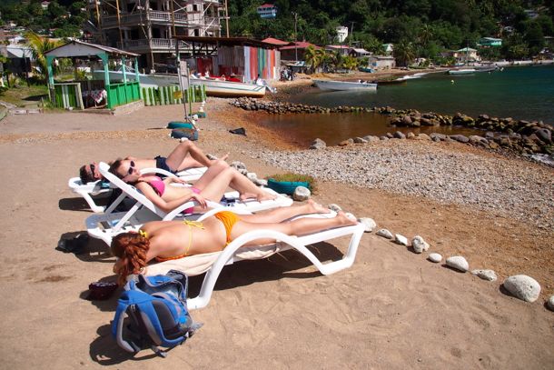Sunbathing at Bubble Beach Spa, Dominica | SBPR