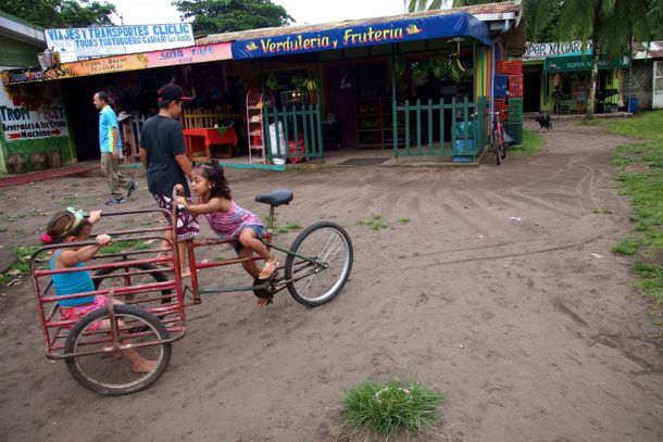 Kids playing along the "road" in Tortuguero