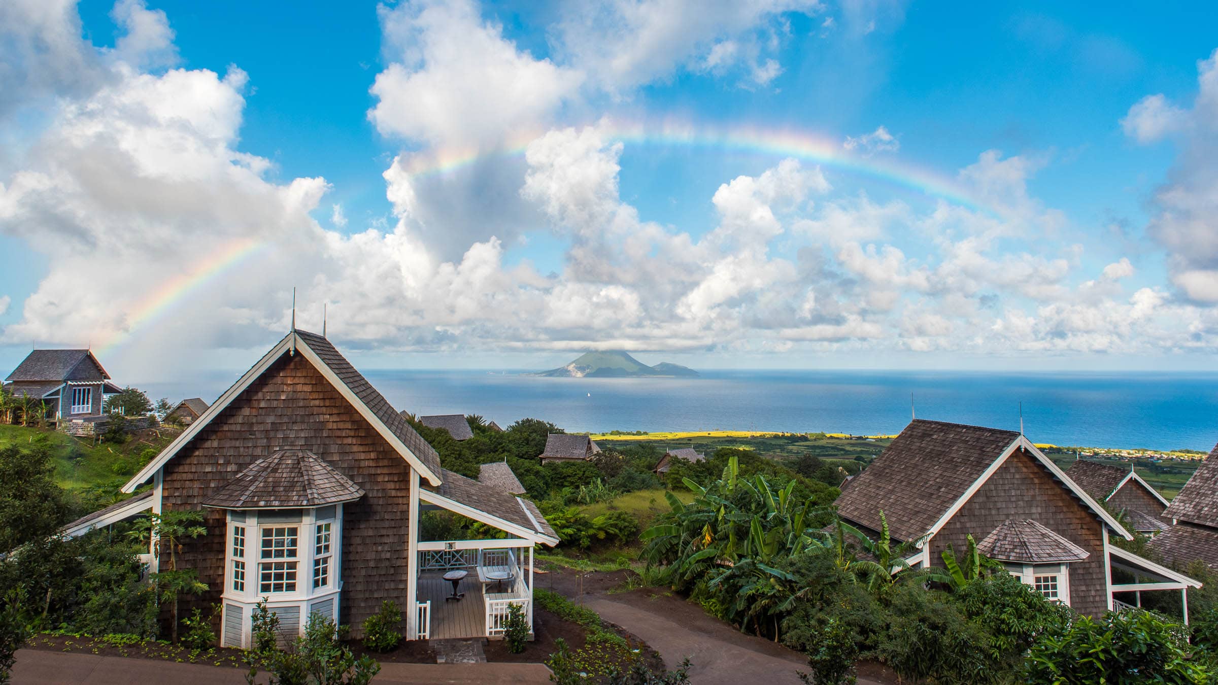 Rainbow over Belle Mont Farm on Kittitian Hill by Patrick Bennett