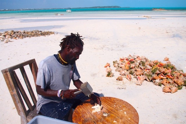 The conch man working hard at Bugaloo's Conch Crawl | SBPR