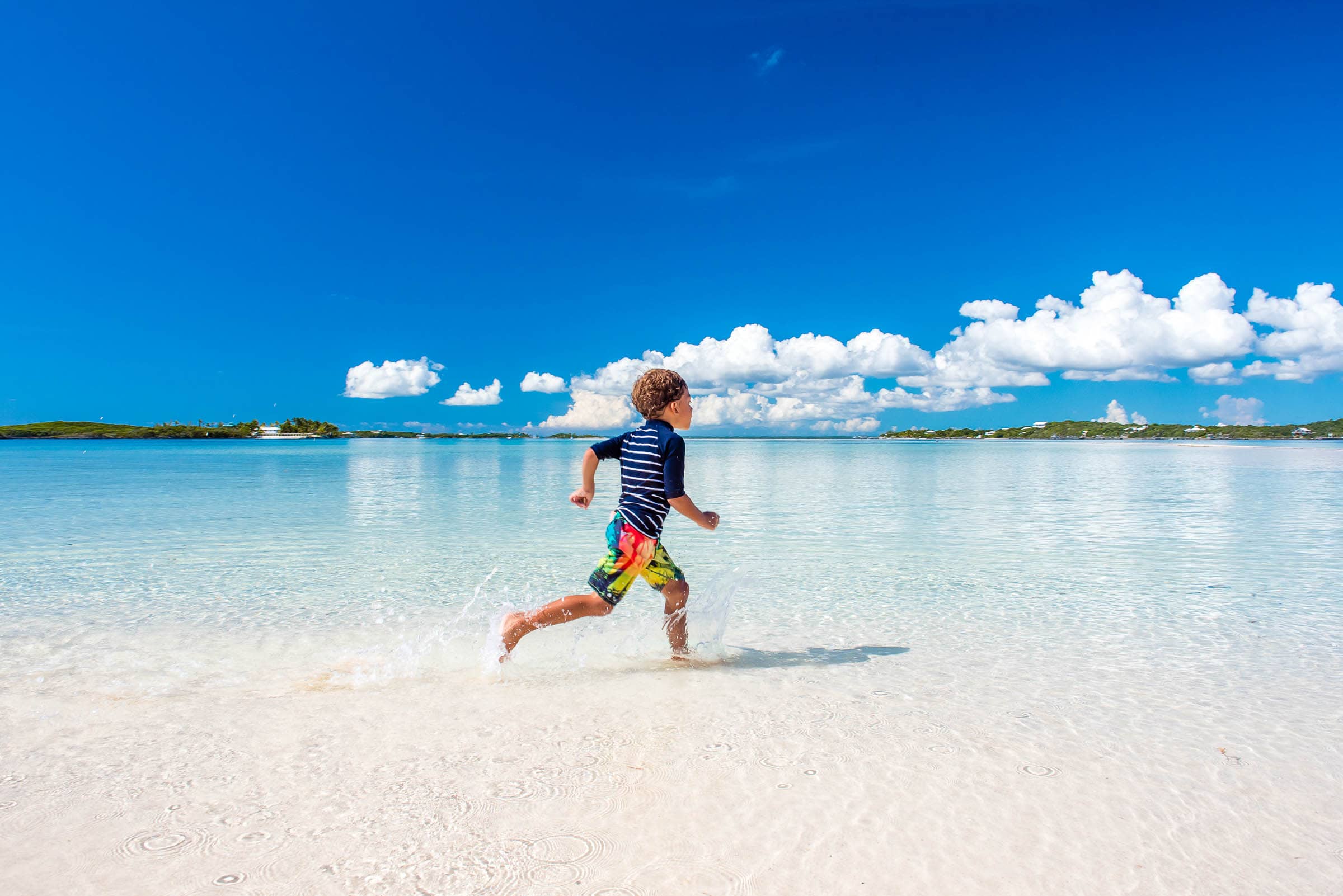 Running on Tahiti Beach, Elbow Cay, Abaco, The Bahamas by Patrick Bennett
