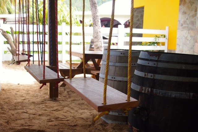 Swings and Rhum Barrels on the beach | SBPR
