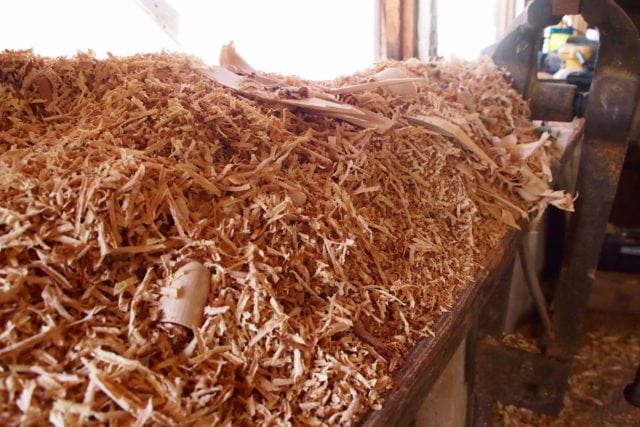 Wood shavings and sawdust piled high inside Joe's Studio | SBPR