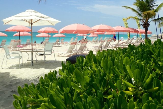 The iconic pink umbrellas at Ocean Club East, Turks and Caicos | SBPR