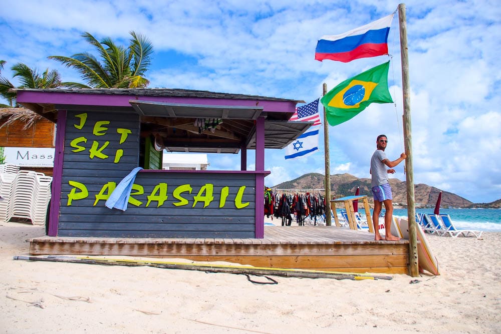 Flags of 120 united nations fly over Orient Beach, St. Martin