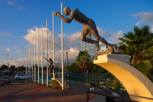 Statues of local sporting greats adorn the grounds outside the Jamaica National Stadium