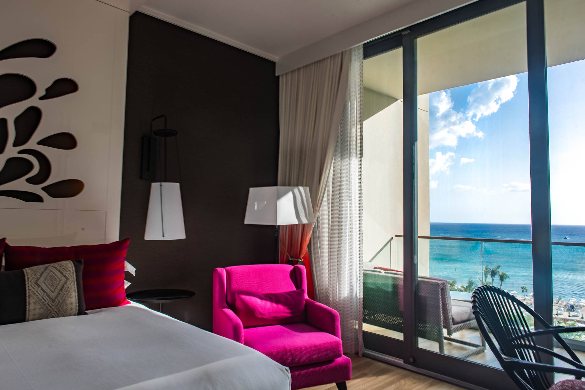 The rooms are modern, brightly accented, and feature huge windows.