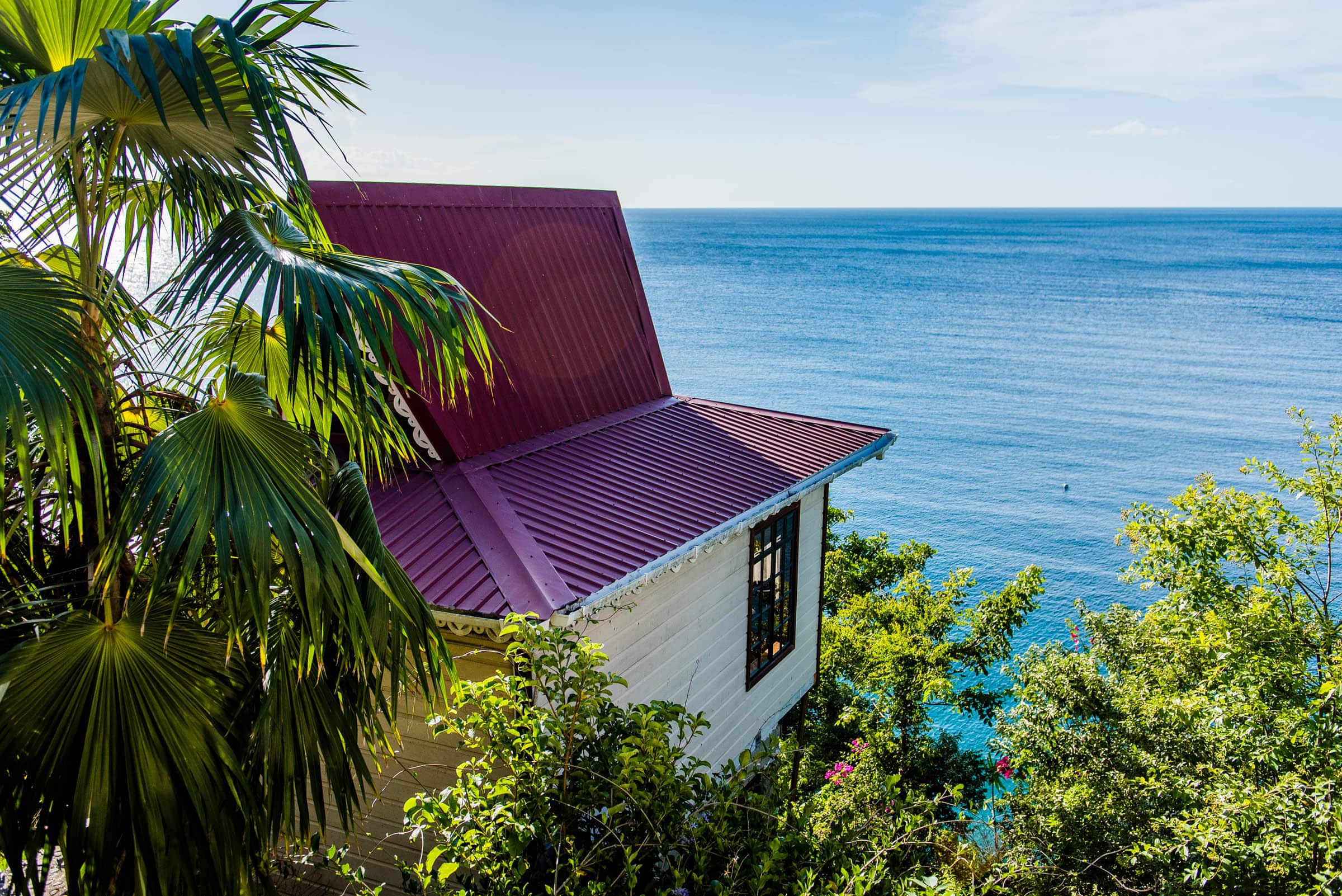 Each cottage overlooks the serene waters and silver sand of the secluded beach below