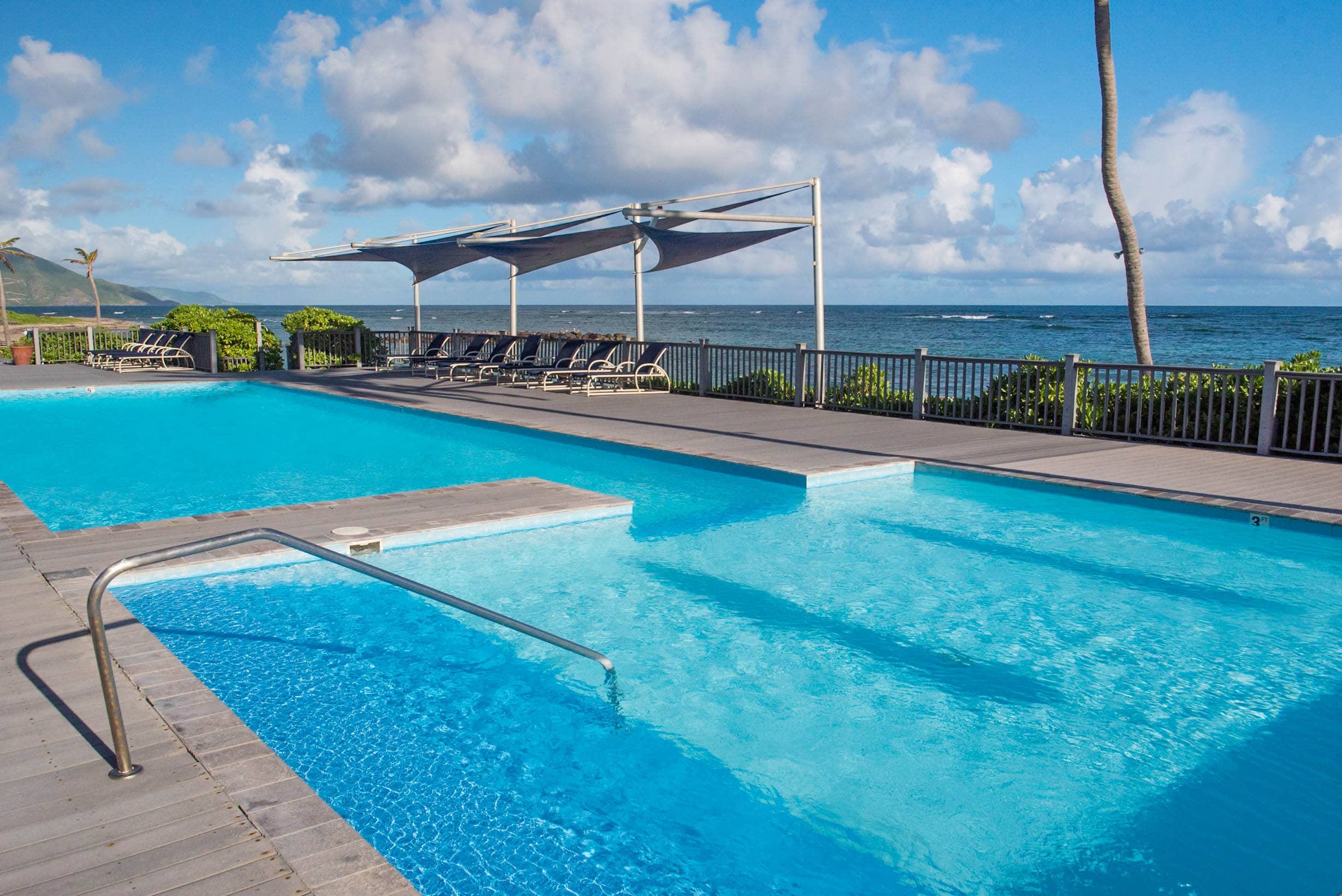The pool area is simply stunning against the cool Caribbean Sea beyond.