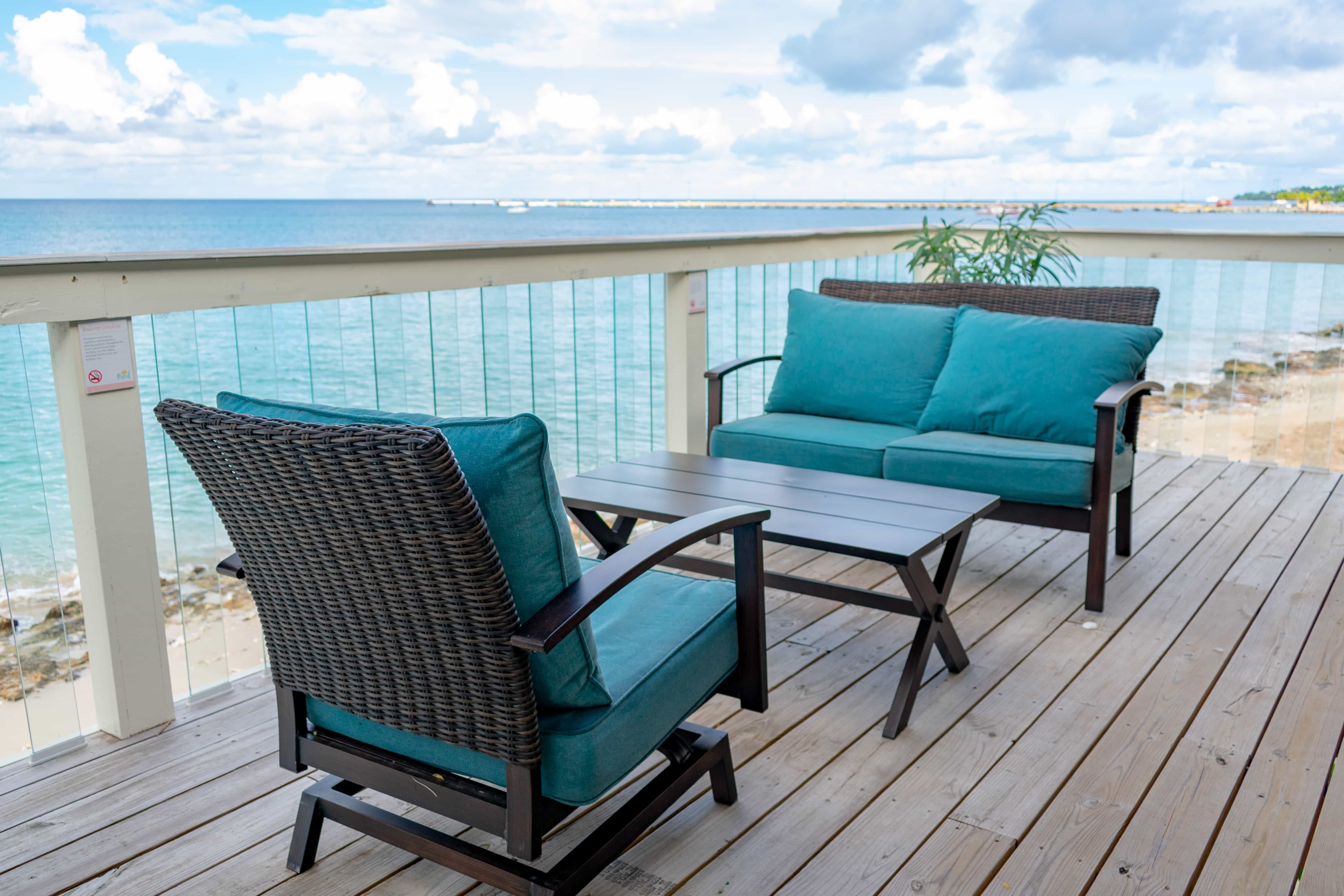 Check out these Comfy chairs and clear balusters that allow for unobstructed views from your balcony.