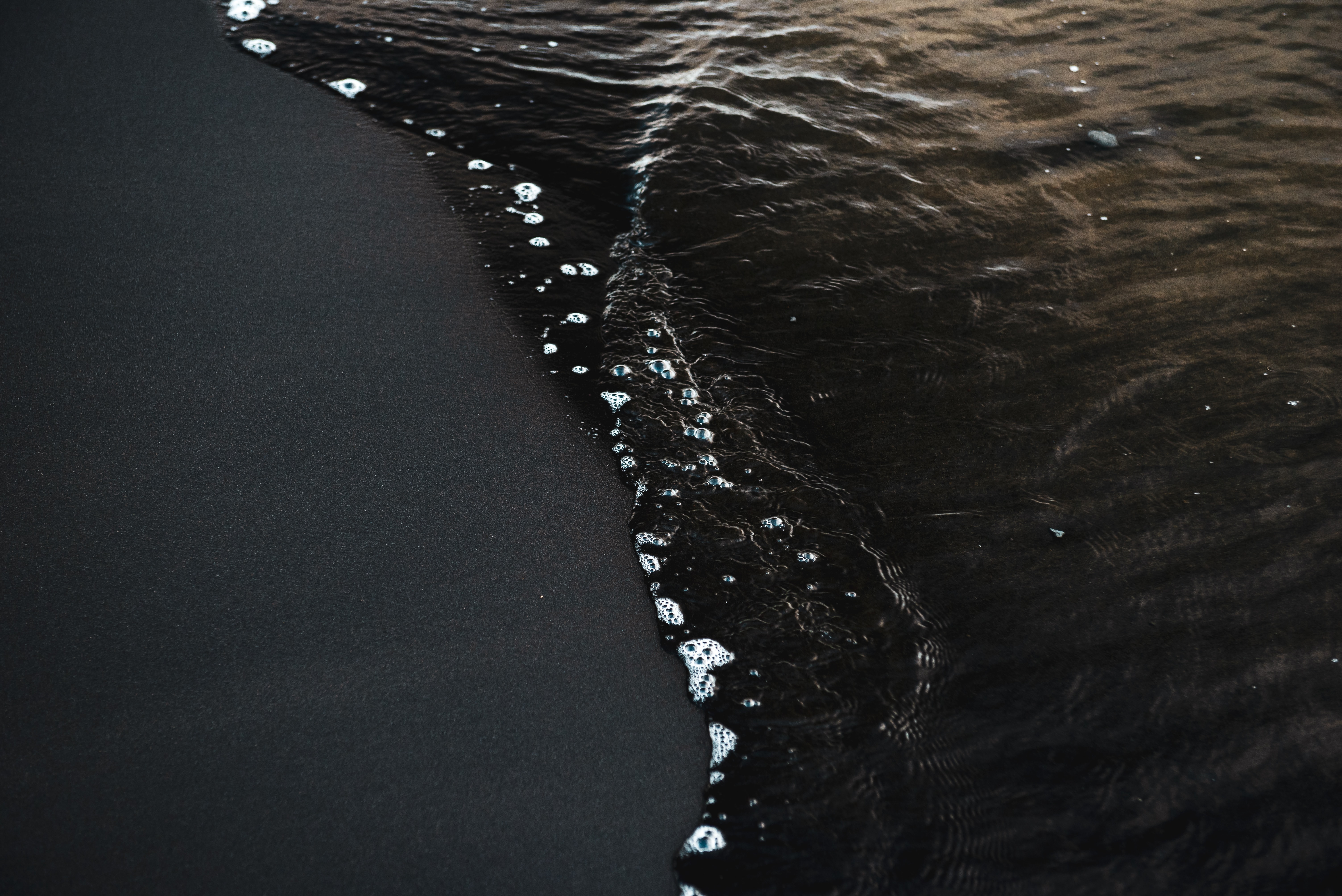 And by black sands, we mean exotic, pristine, and inviting black sands.