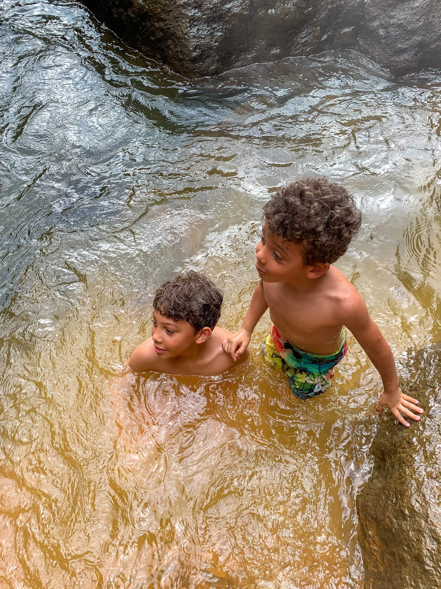 Little junies enjoying Papa's hot spring at Trafalgar Falls, Dominica
