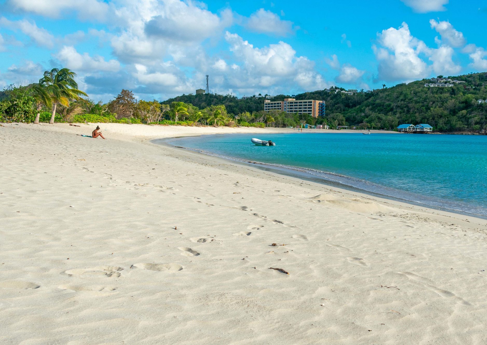 Beach Reading Book Along Deep Bay, Antigua