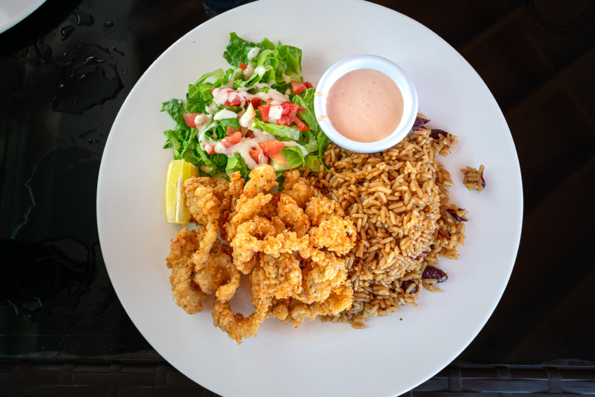 Mudjin Bar and Grille cracked conch with peas and rice 